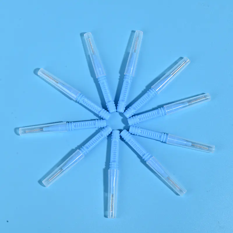 Light blue I-type interdental brushes with protective caps arranged in star shape, wholesale dental cleaning tools from Qingdao factory