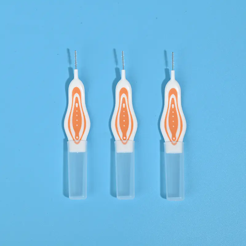 Three orange printed ergonomic curved handle interdental brushes with transparent protective tube, single size portable orthodontic teeth gap cleaners